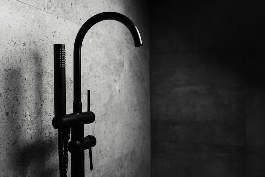 Photo,Of,Black,Floor-standing,Bath,Taps,,On,The,Background,Of